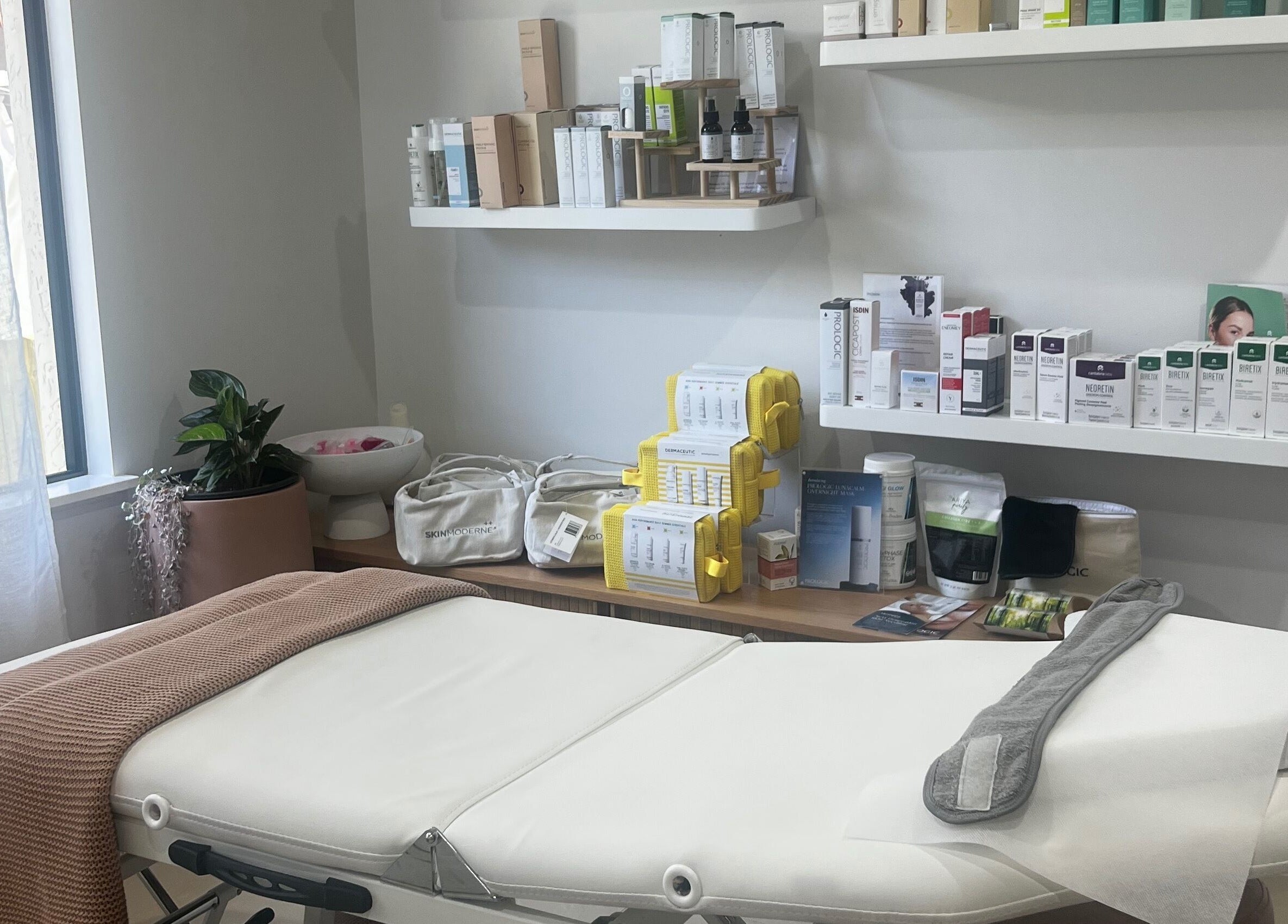 Luxurious treatment room at Healthy Skin Lab, Trinity Beach, Queensland, AU, showcasing premium skincare products.