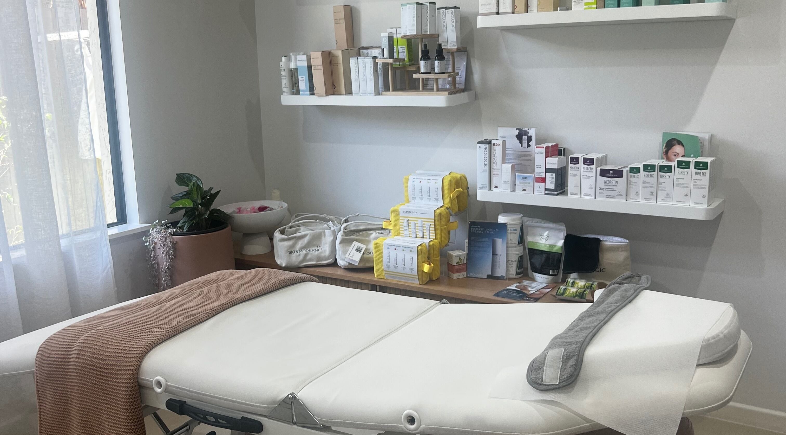 Luxurious treatment room at Healthy Skin Lab, Trinity Beach, Queensland, AU, showcasing premium skincare products.