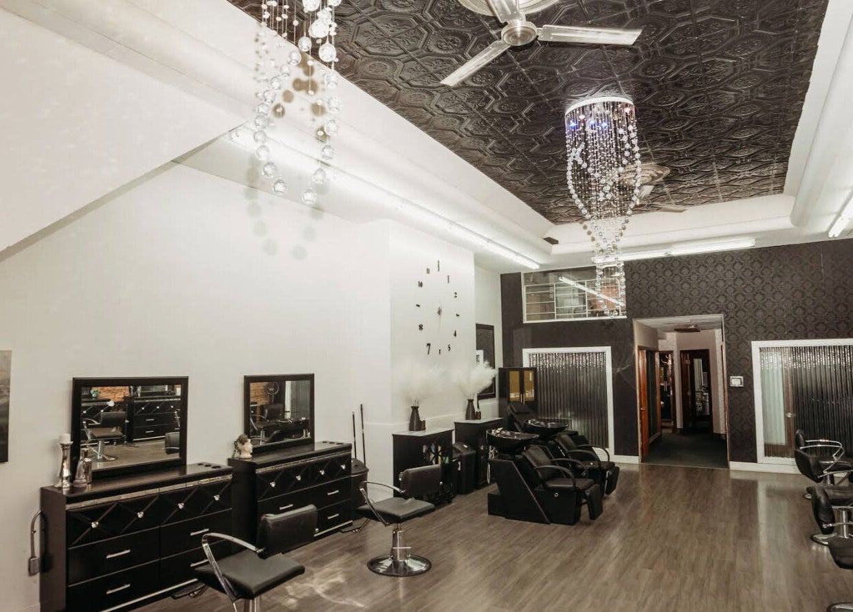 Modern interior of Emmah at Transcendence Salon & Spa, Columbus, Nebraska, US, with sleek styling stations.