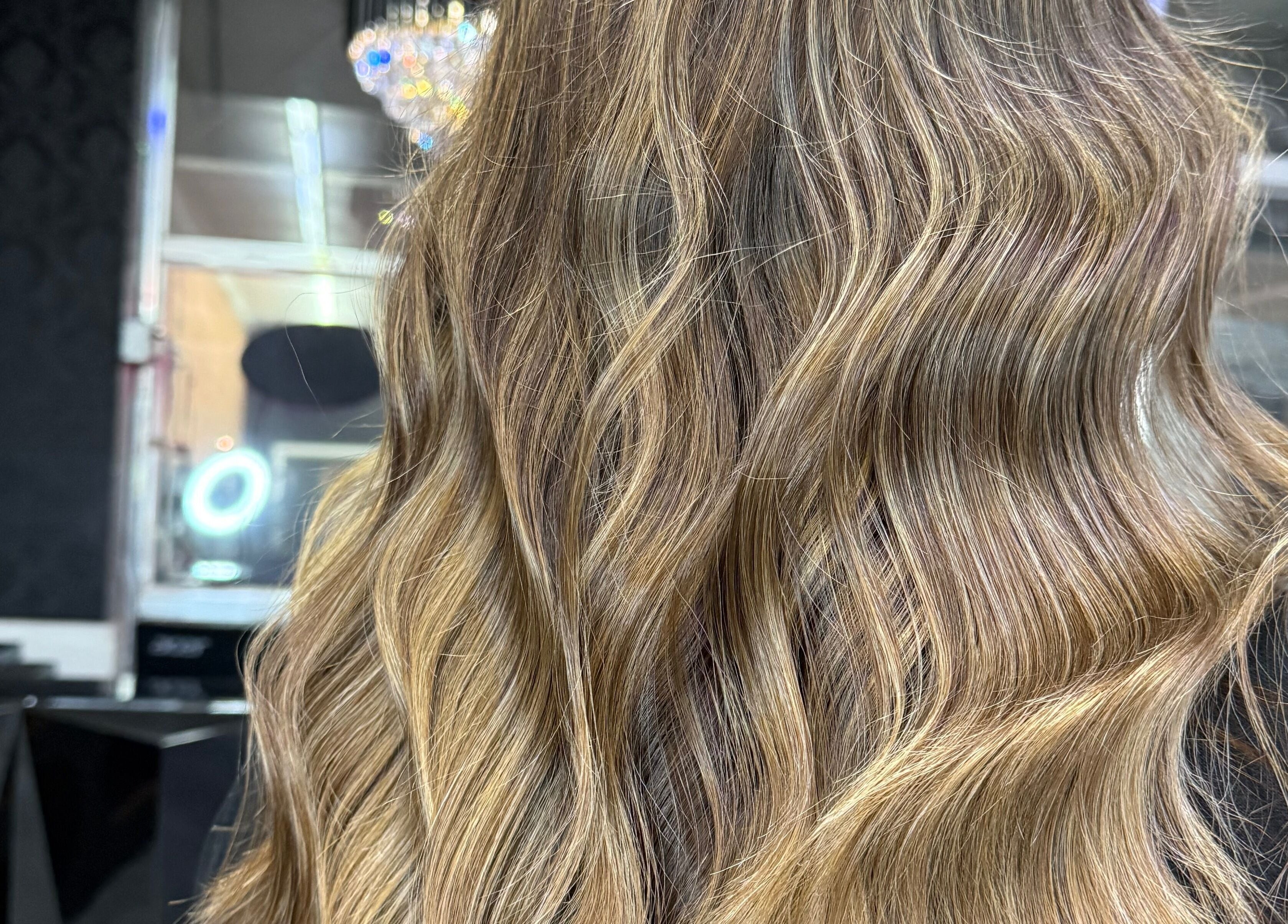Close-up of styled, radiant curls at Emmah at Transcendence Salon & Spa in Columbus, Nebraska, US.