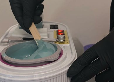 Close-up of waxing preparation at Perfect Beauty Setubal, Setúbal, Setúbal, PT showing blue wax being stirred.