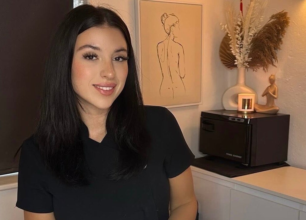 BBH SKIN staff member smiling at the serene beauty room, Brent Pelham, England, GB.