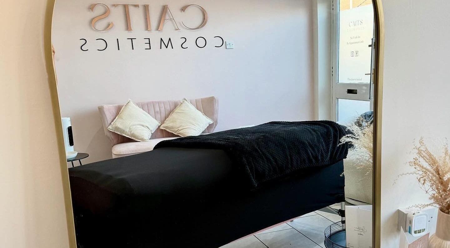 Cozy treatment room at Caits Cosmetics, Whittlesey, England, GB with soft seating and elegant decor.