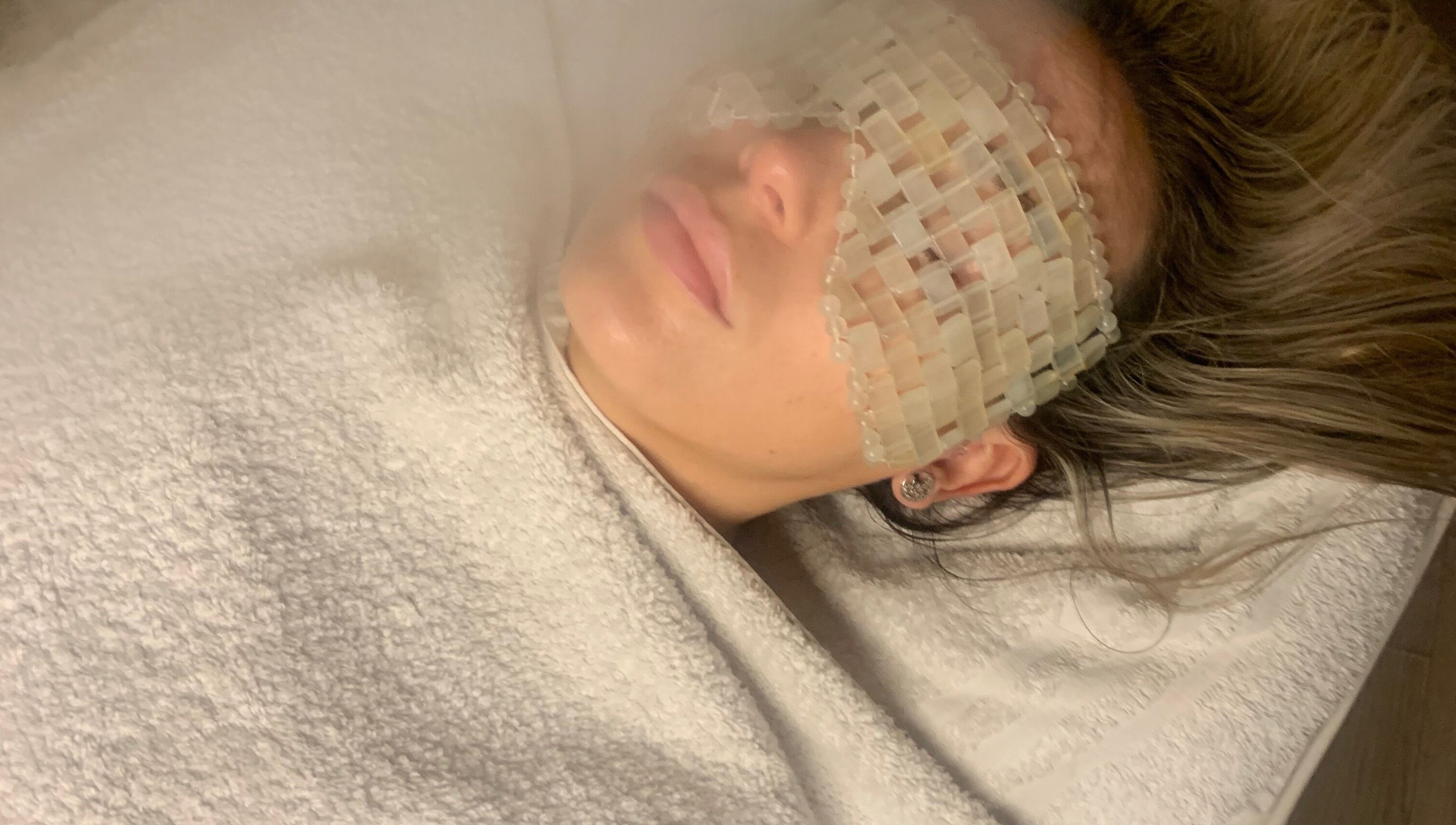 Relaxing facial treatment at Face and Body MCR in Eccles, England, GB with soothing eye mask.