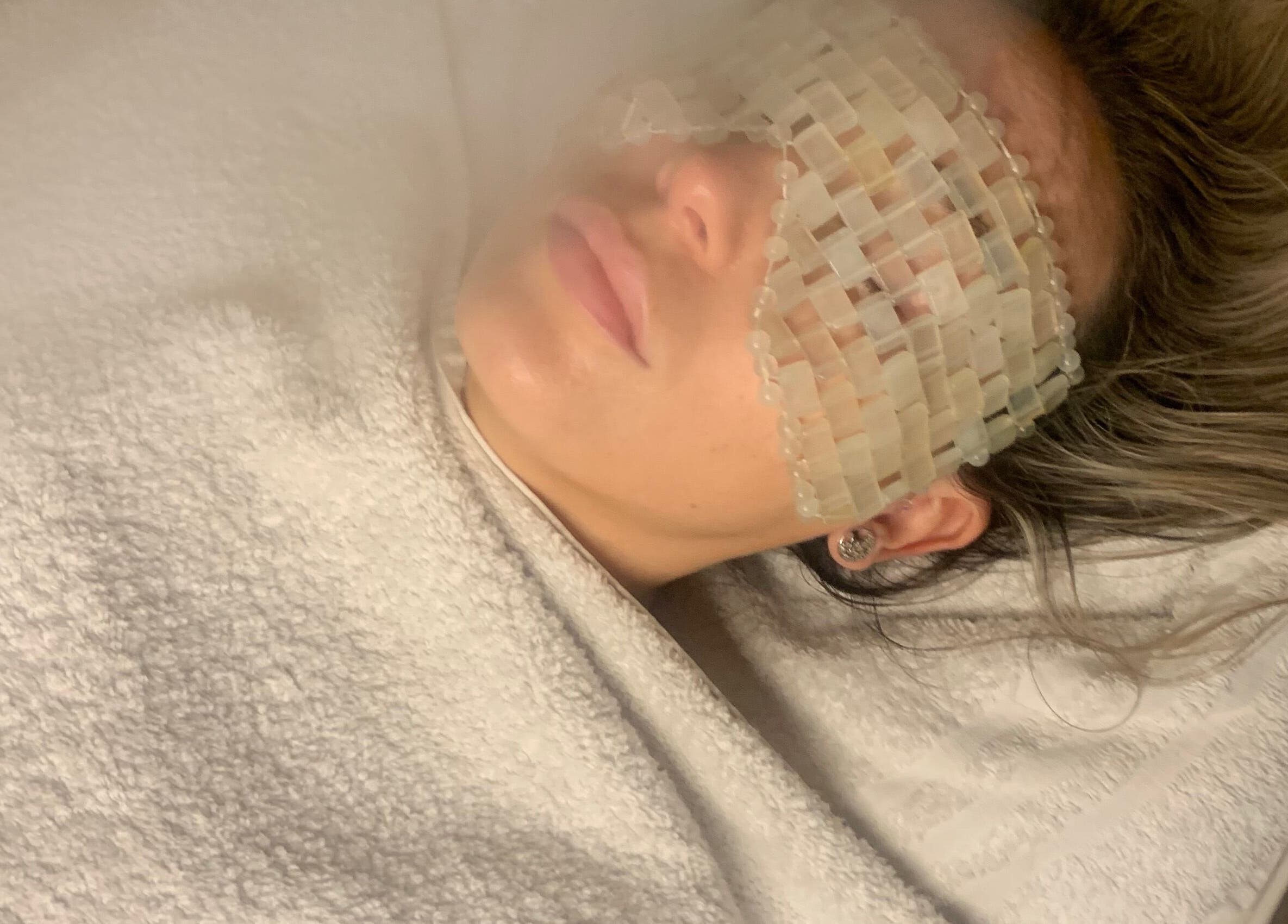 Relaxing facial treatment at Face and Body MCR in Eccles, England, GB with soothing eye mask.