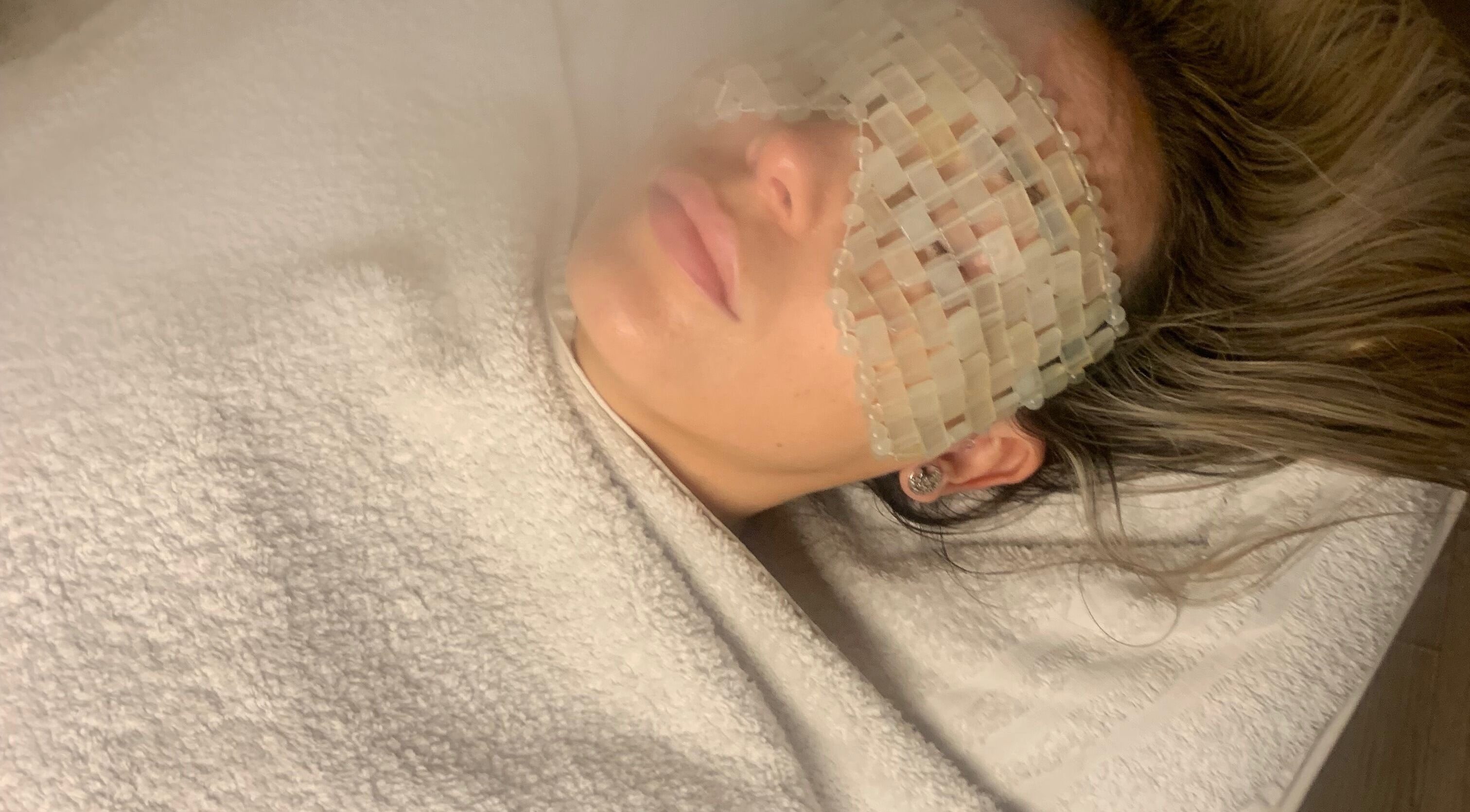 Relaxing facial treatment at Face and Body MCR in Eccles, England, GB with soothing eye mask.