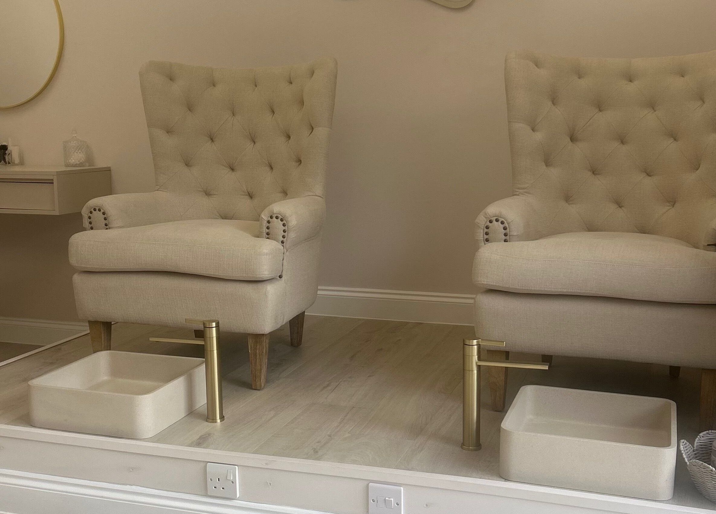 Elegant pedicure chairs at Olea The Room of Beauty in Hemingford Grey, England, GB, showcasing luxury and comfort.