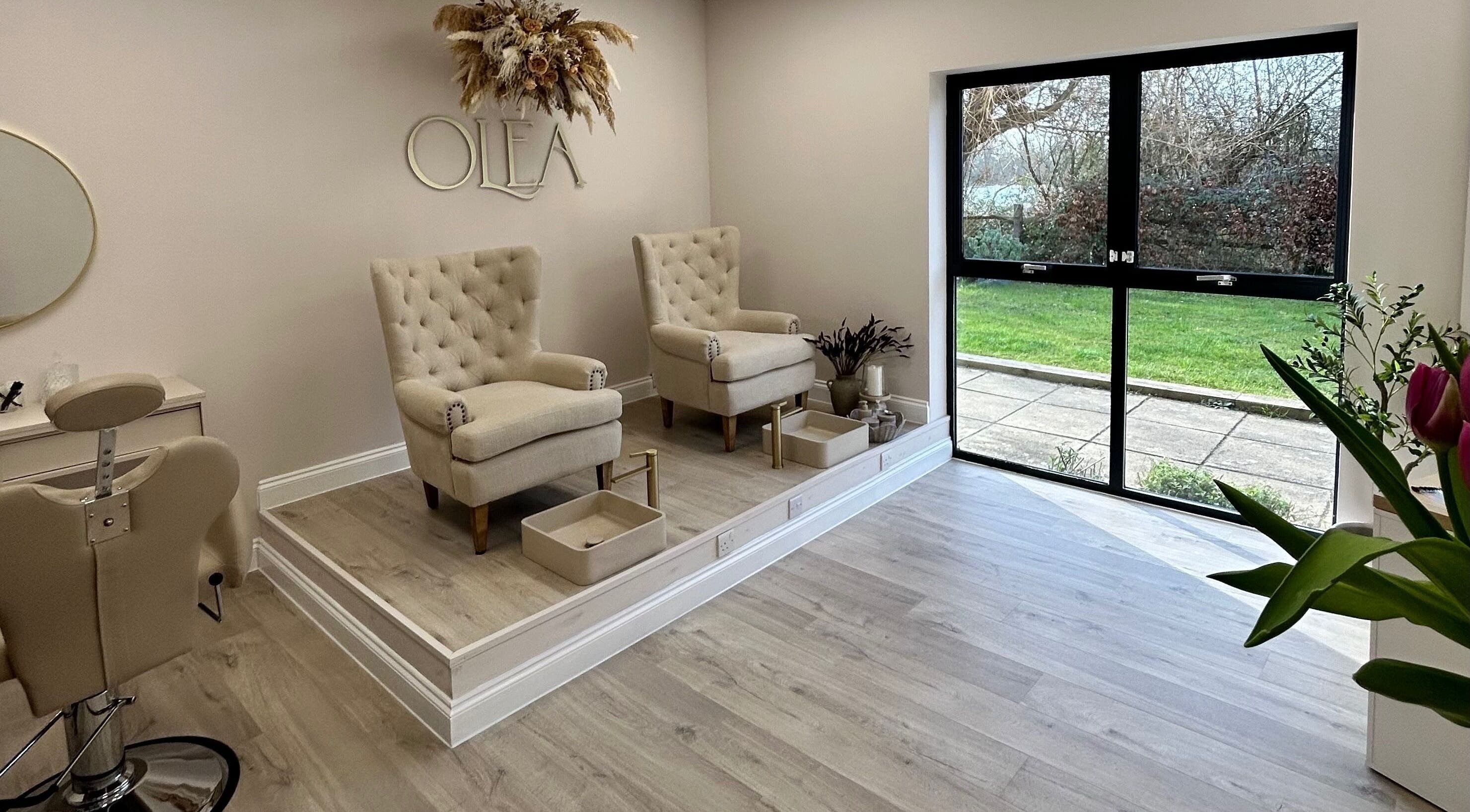 Chic pedicure area at Olea The Room of Beauty in Hemingford Grey, England, GB with plush seating and serene decor.