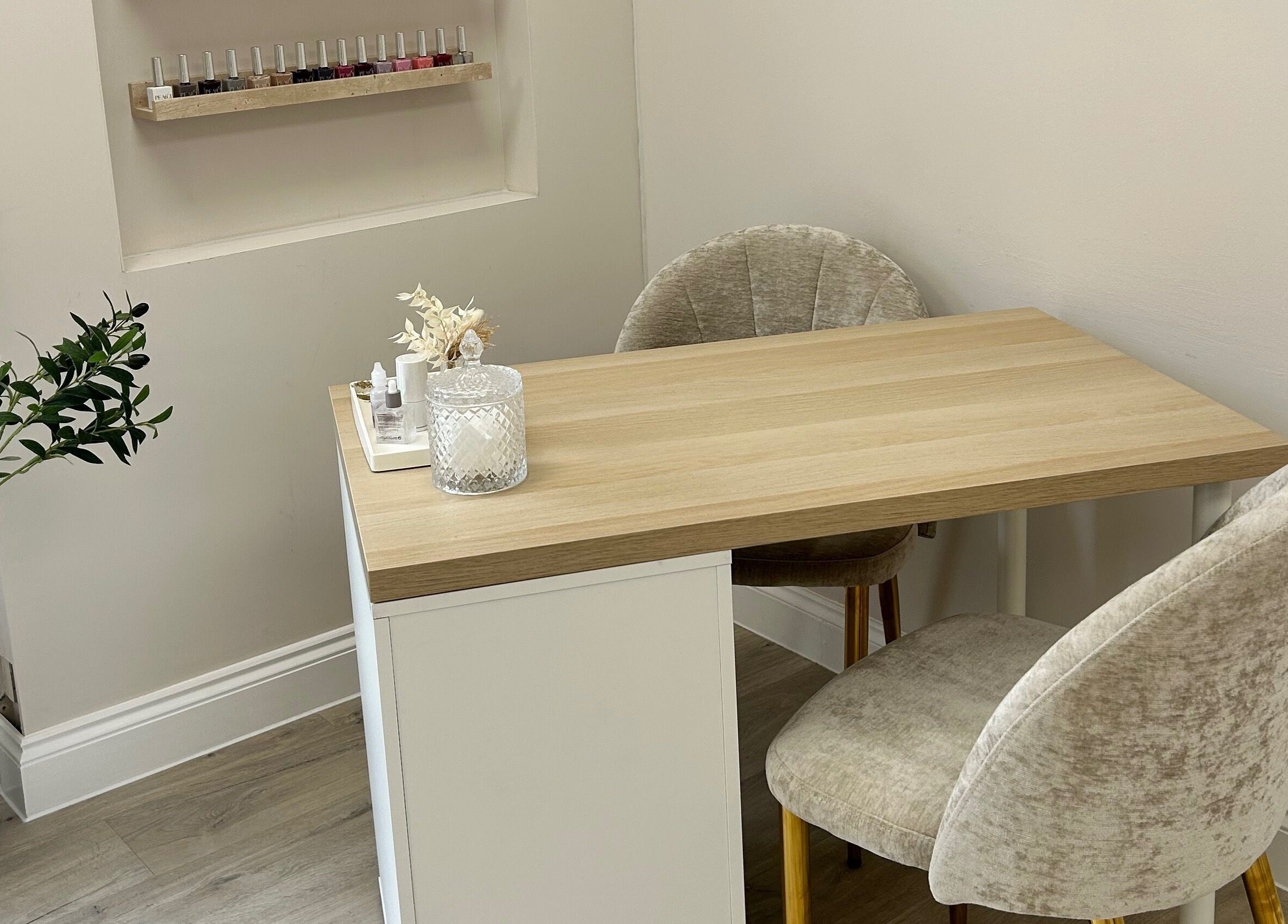 Cozy nail station at Olea The Room of Beauty in Hemingford Grey, England, GB, complete with chic decor.