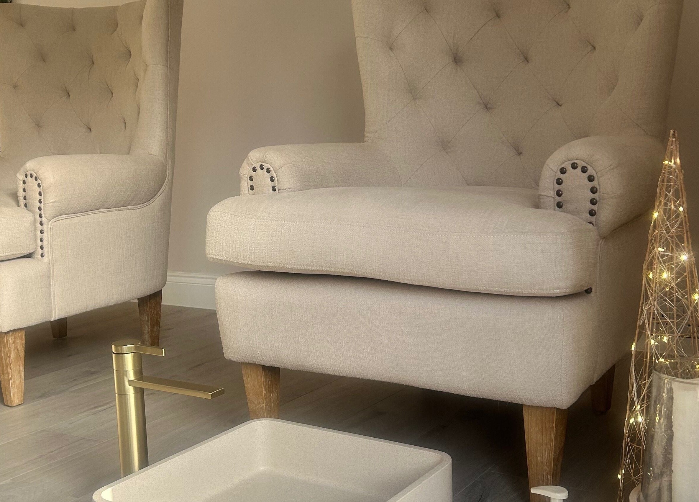 Elegant beige chairs at Olea The Room of Beauty in Hemingford Grey, England, GB, offering a luxurious, serene ambiance.