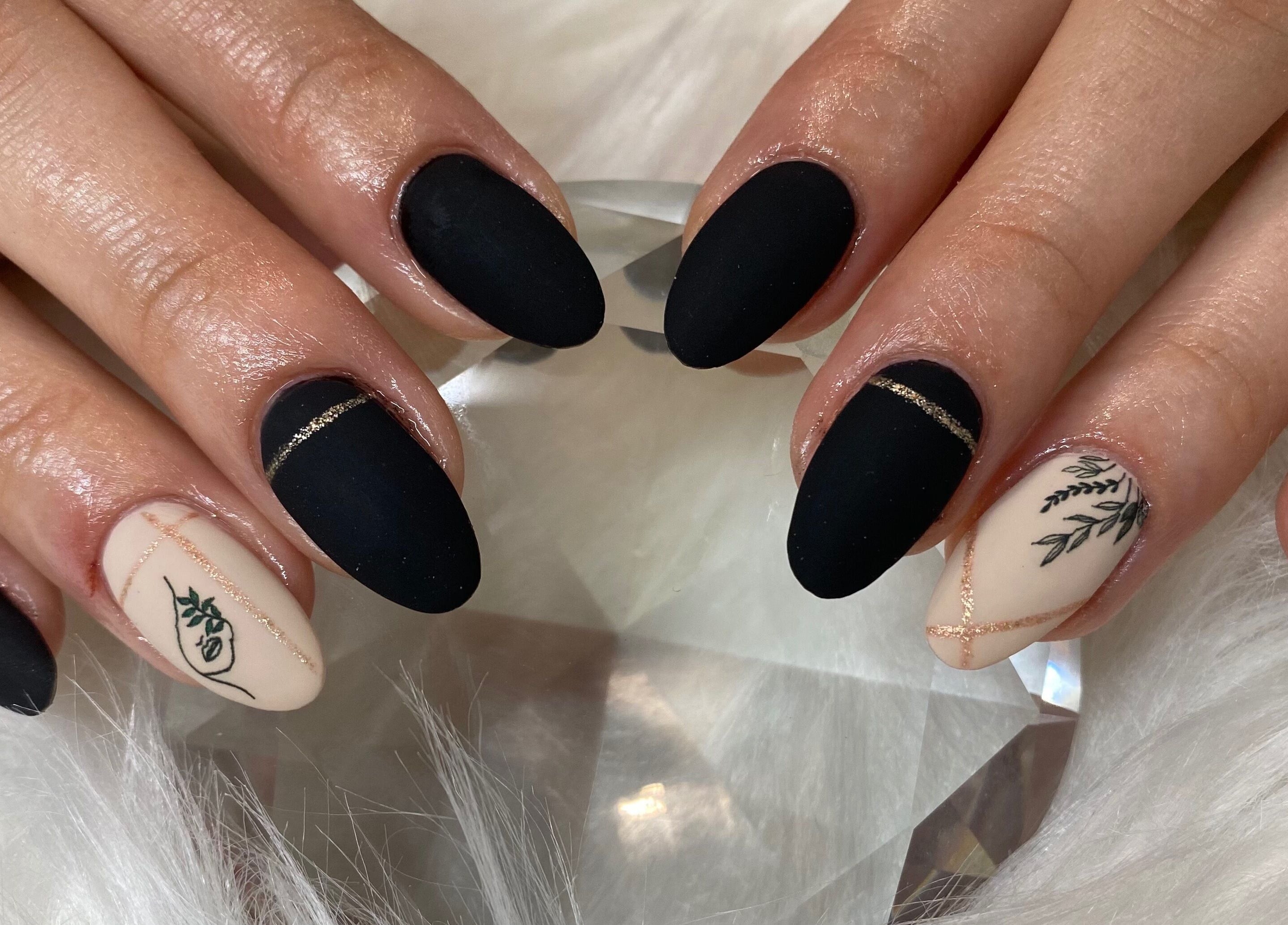 Elegant black matte nails with floral accent at Bron’s Boho Beautique, Centurion, Gauteng, ZA.