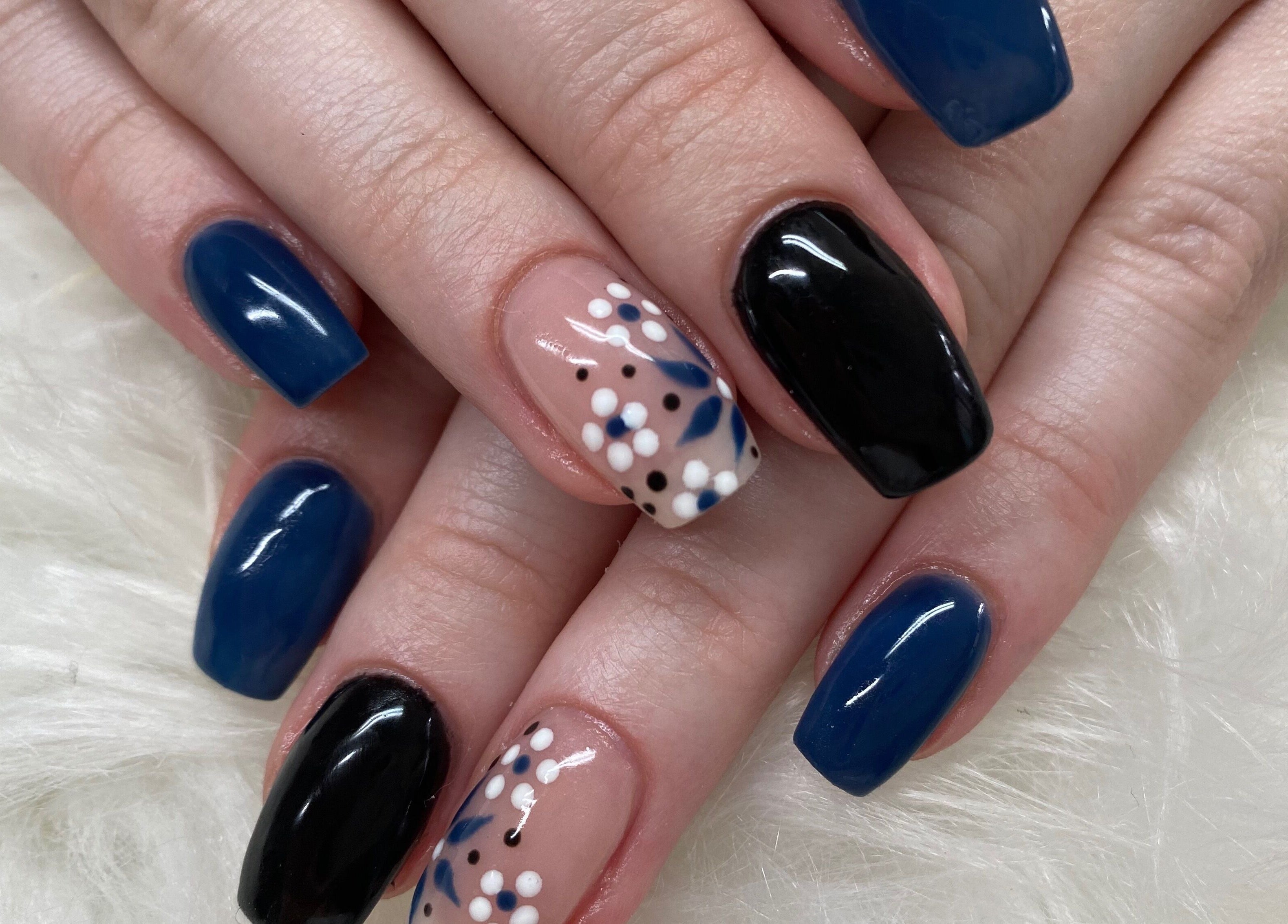 Stylish nail art with blue, black, floral designs at Bron’s Boho Beautique, Centurion, Gauteng, ZA.