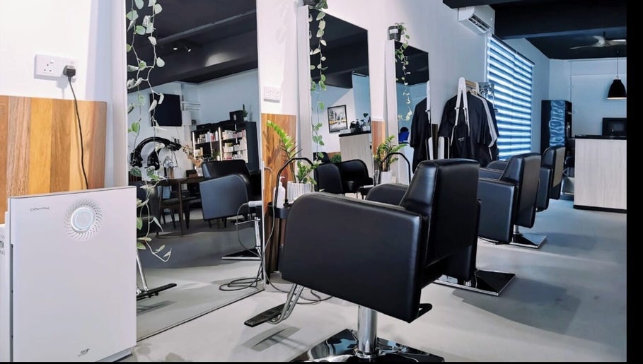 Stylish chairs and mirrors at Van Coiffeur Hair Studio, Malacca, Malacca, MY, showcasing modern salon design.