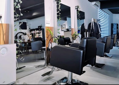 Stylish chairs and mirrors at Van Coiffeur Hair Studio, Malacca, Malacca, MY, showcasing modern salon design.