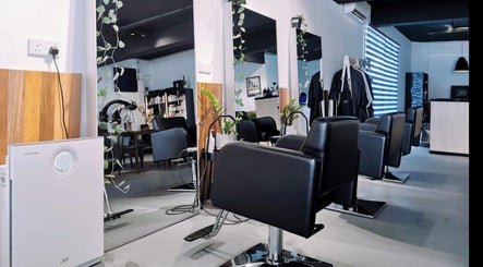 Stylish chairs and mirrors at Van Coiffeur Hair Studio, Malacca, Malacca, MY, showcasing modern salon design.
