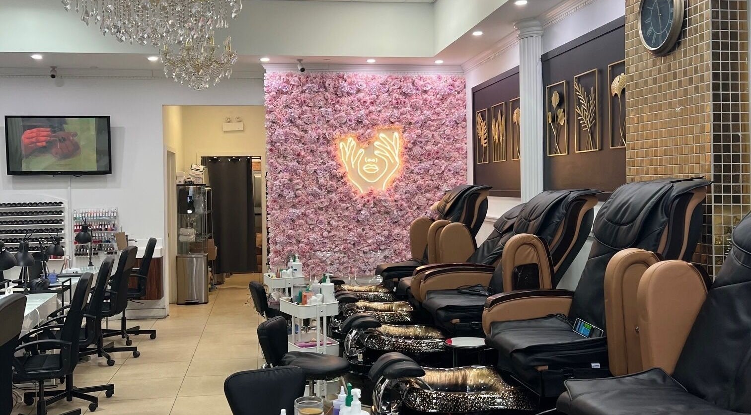Modern nail salon interior at Nails For You Dundas, Toronto, Ontario, CA, featuring plush pedicure chairs and floral wall.