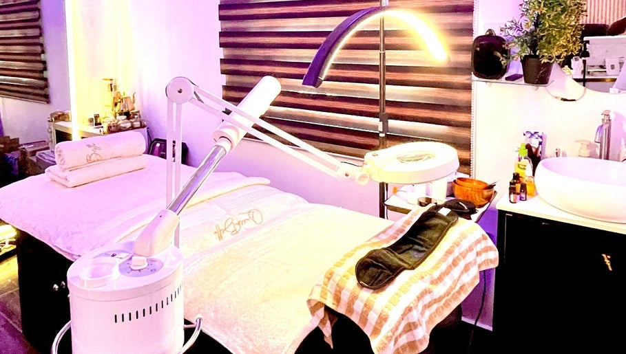 Relaxing spa room at Queen Bello Services, Lagos, NG with massage table and ambient lighting.