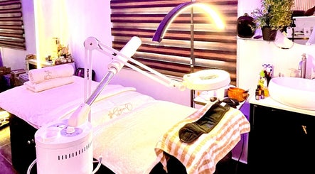 Relaxing spa room at Queen Bello Services, Lagos, NG with massage table and ambient lighting.