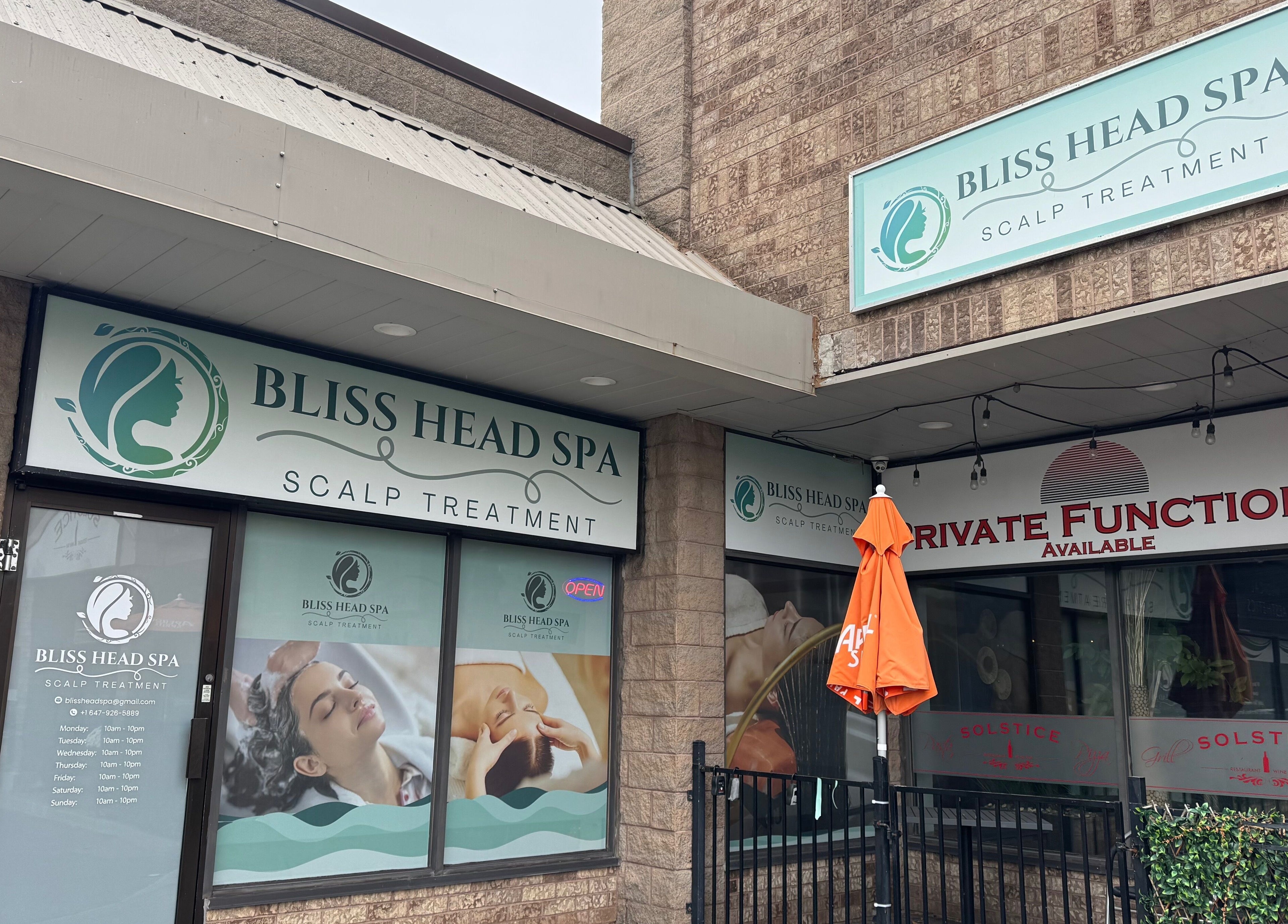 Entrance of Bliss Head Spa in Mississauga, Ontario, CA, showcasing scalp treatment signage.
