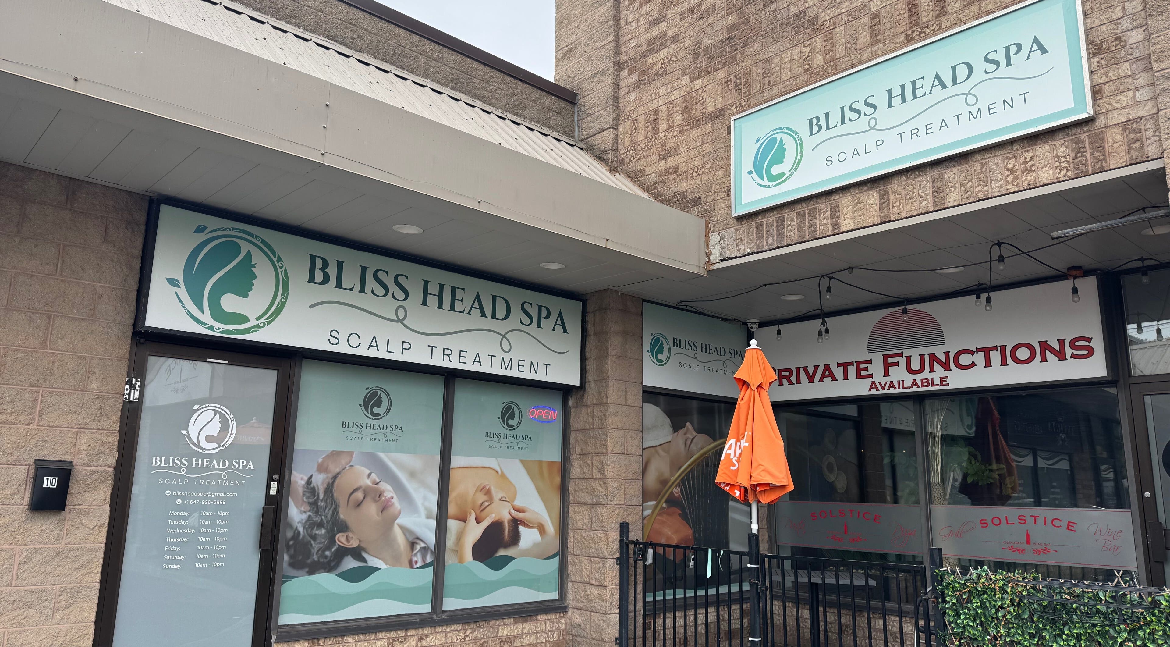Entrance of Bliss Head Spa in Mississauga, Ontario, CA, showcasing scalp treatment signage.