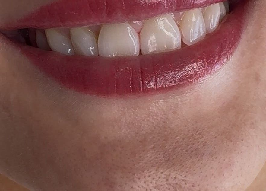 Close-up of a woman's lips with red lipstick from Dahlyns Permanent Makeup, Liverpool, England, GB.