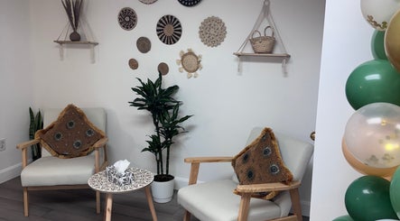 Cozy seating with boho decor at Bien-être Boho NDG in Montréal, Québec, CA, showcasing natural vibes.