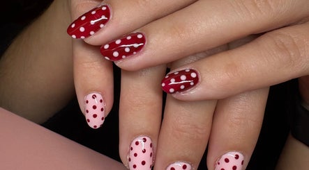 Elegant red and pink polka dot nails by Nails by Emily in Camberley, England, GB.