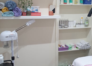 Cozy beauty room setup at Twinz Beauty (Ladies only), Tamworth, England, GB with towels and skincare products.