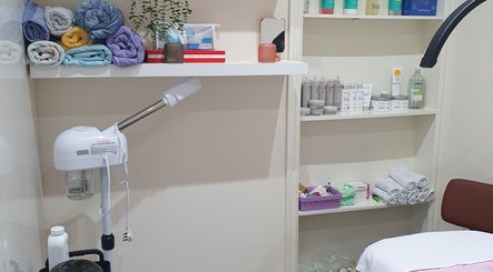 Cozy beauty room setup at Twinz Beauty (Ladies only), Tamworth, England, GB with towels and skincare products.
