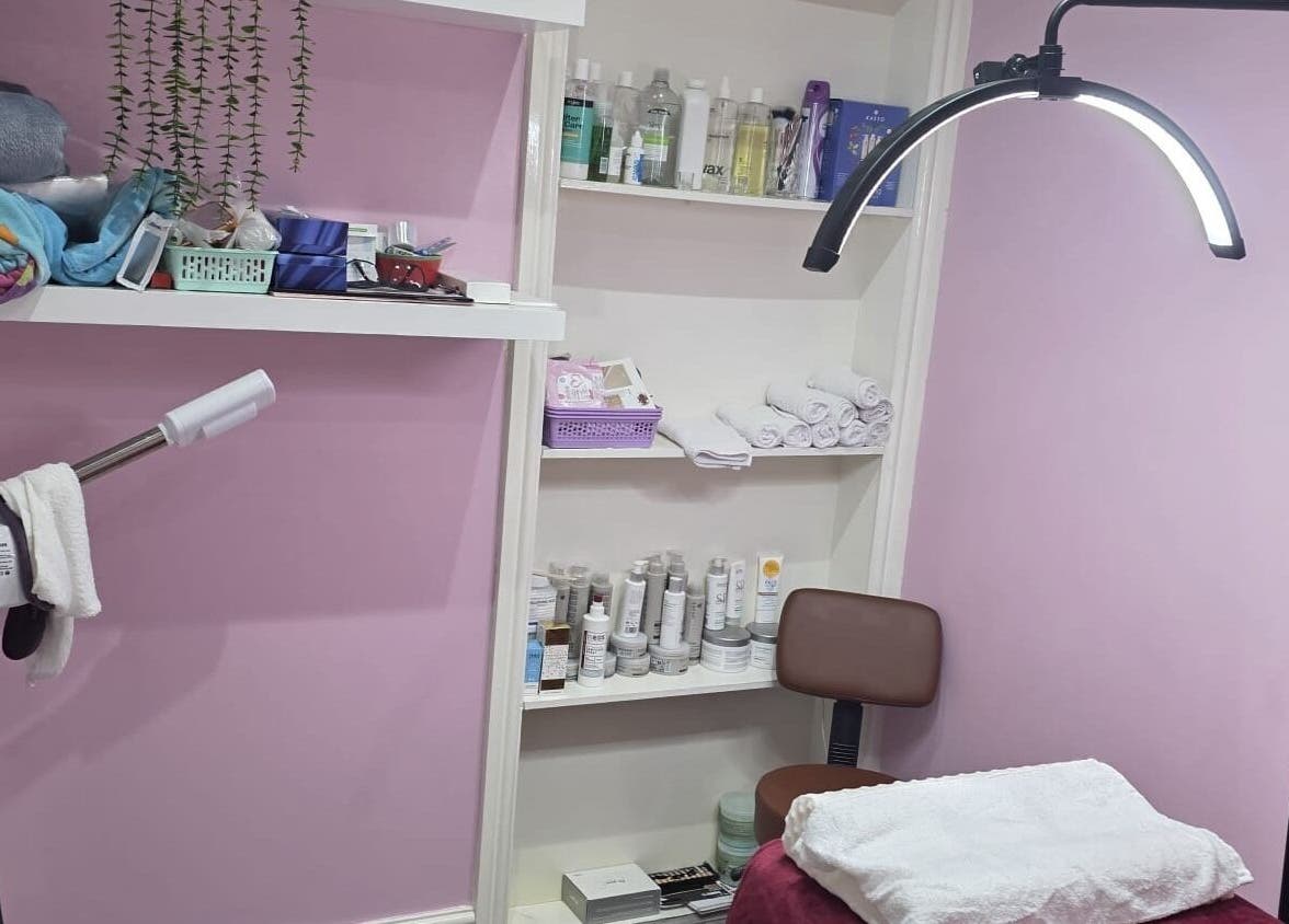 Relaxing treatment room at Twinz Beauty (Ladies only), Tamworth, England featuring products and decor.