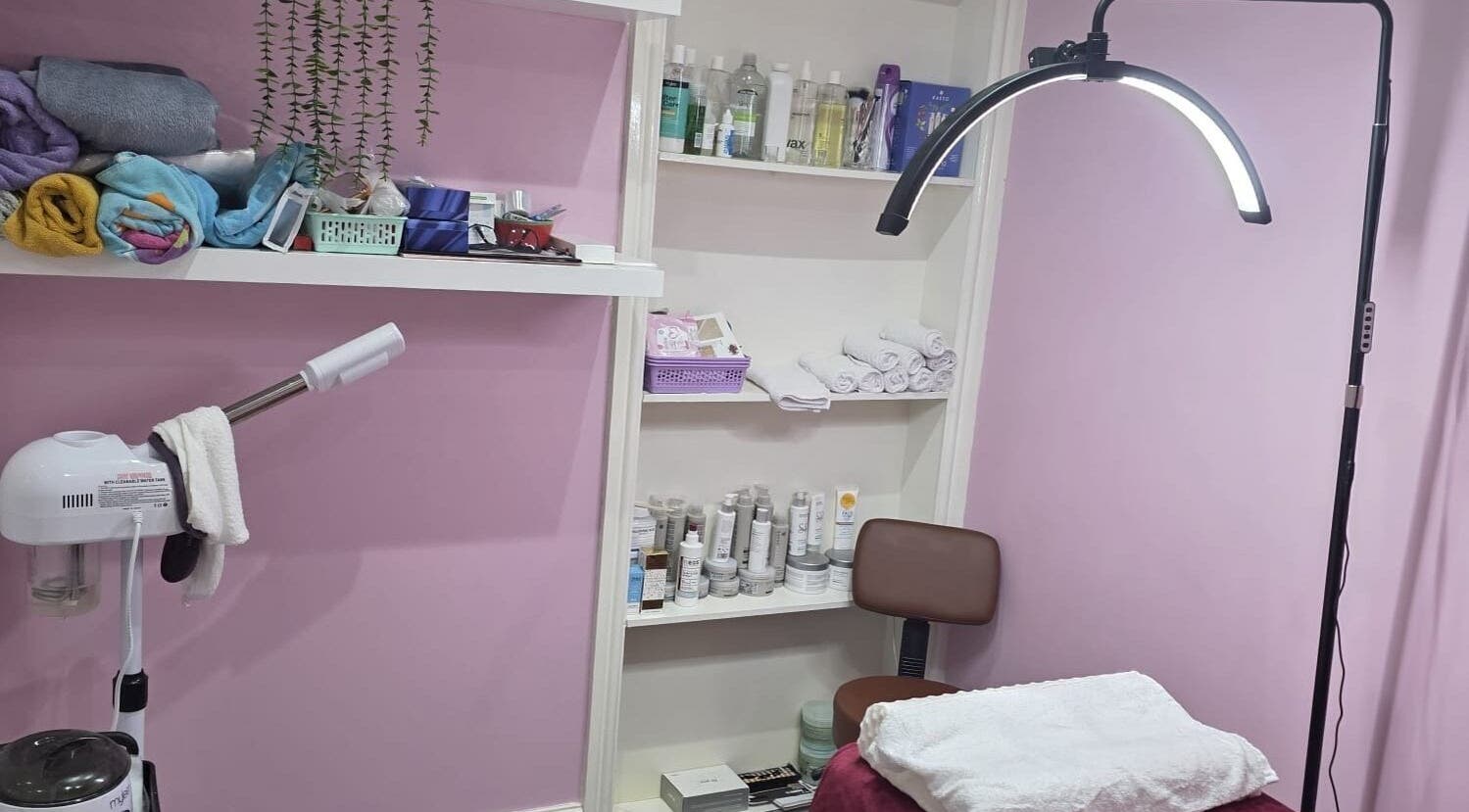 Relaxing treatment room at Twinz Beauty (Ladies only), Tamworth, England featuring products and decor.