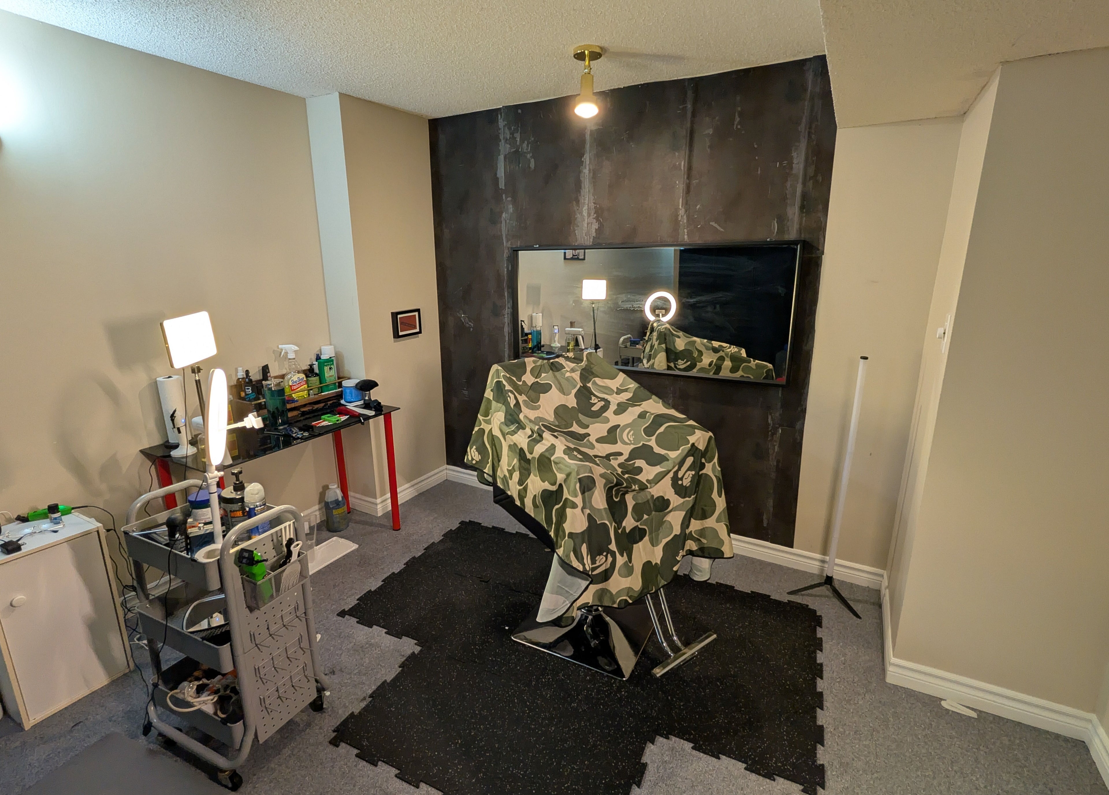 Stylish barber setup at T.Cutzzz in Pickering, Ontario, CA with tools and mirror.