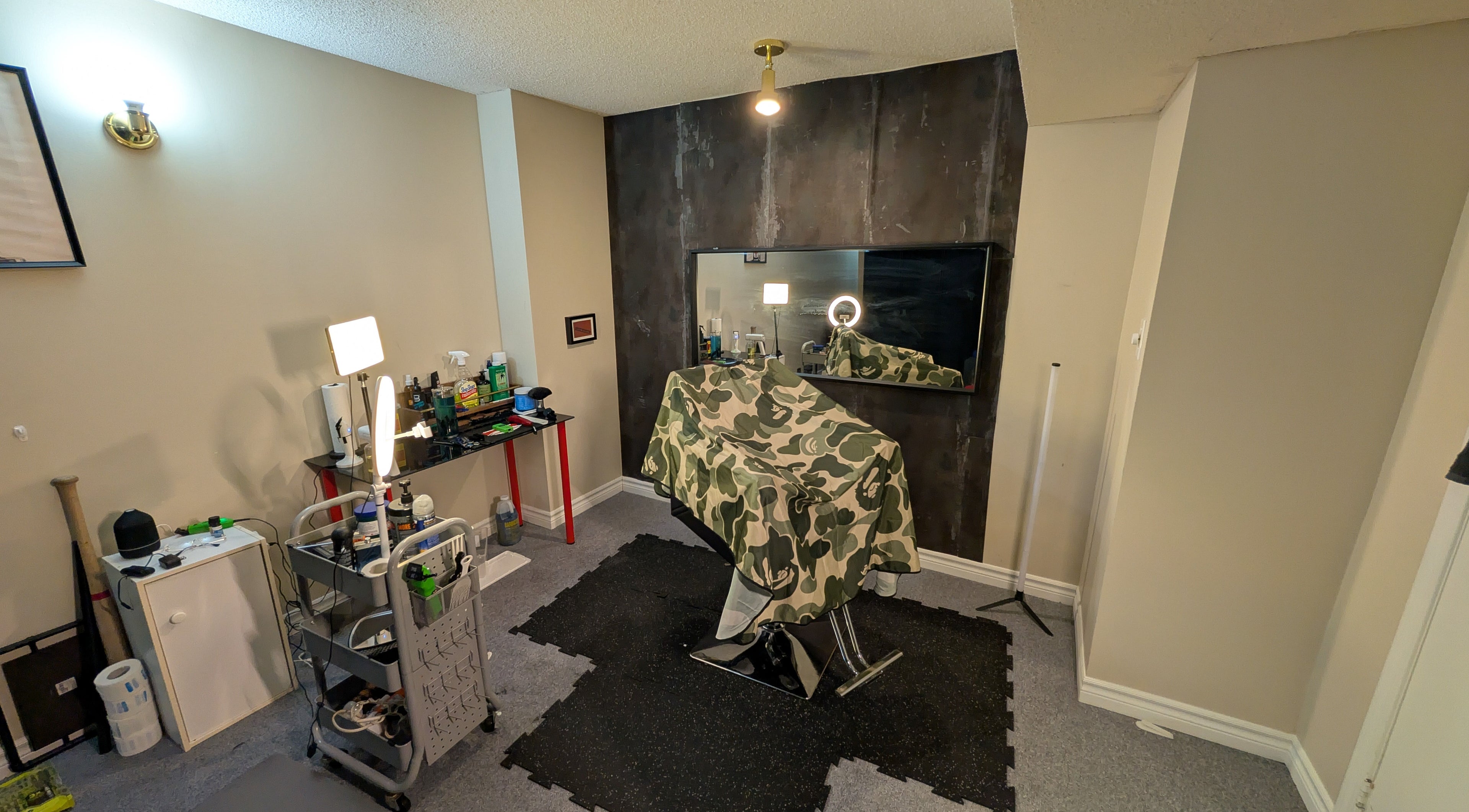 Stylish barber setup at T.Cutzzz in Pickering, Ontario, CA with tools and mirror.