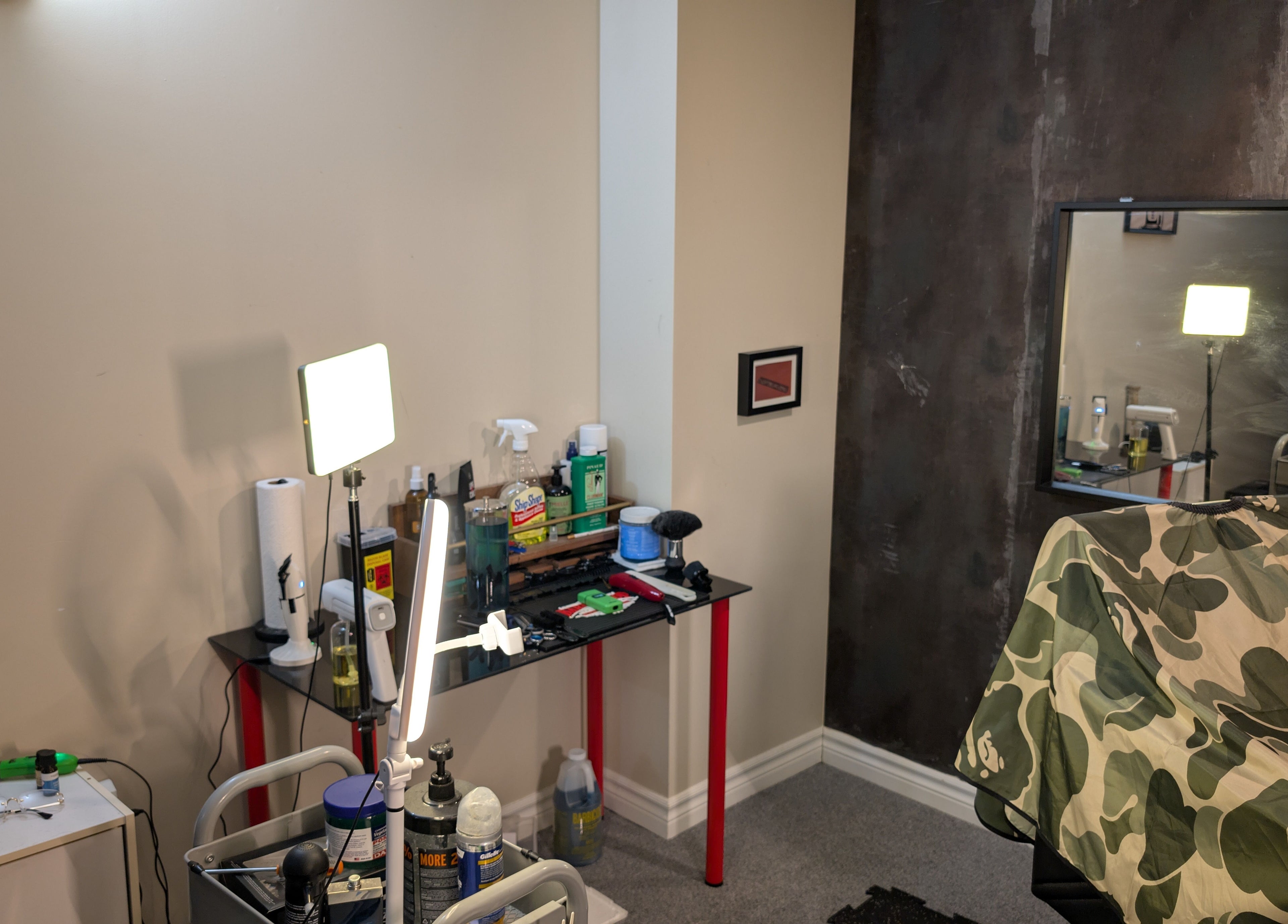 Barber station at T.Cutzzz, Pickering, Ontario, CA showcasing tools and camo cape.