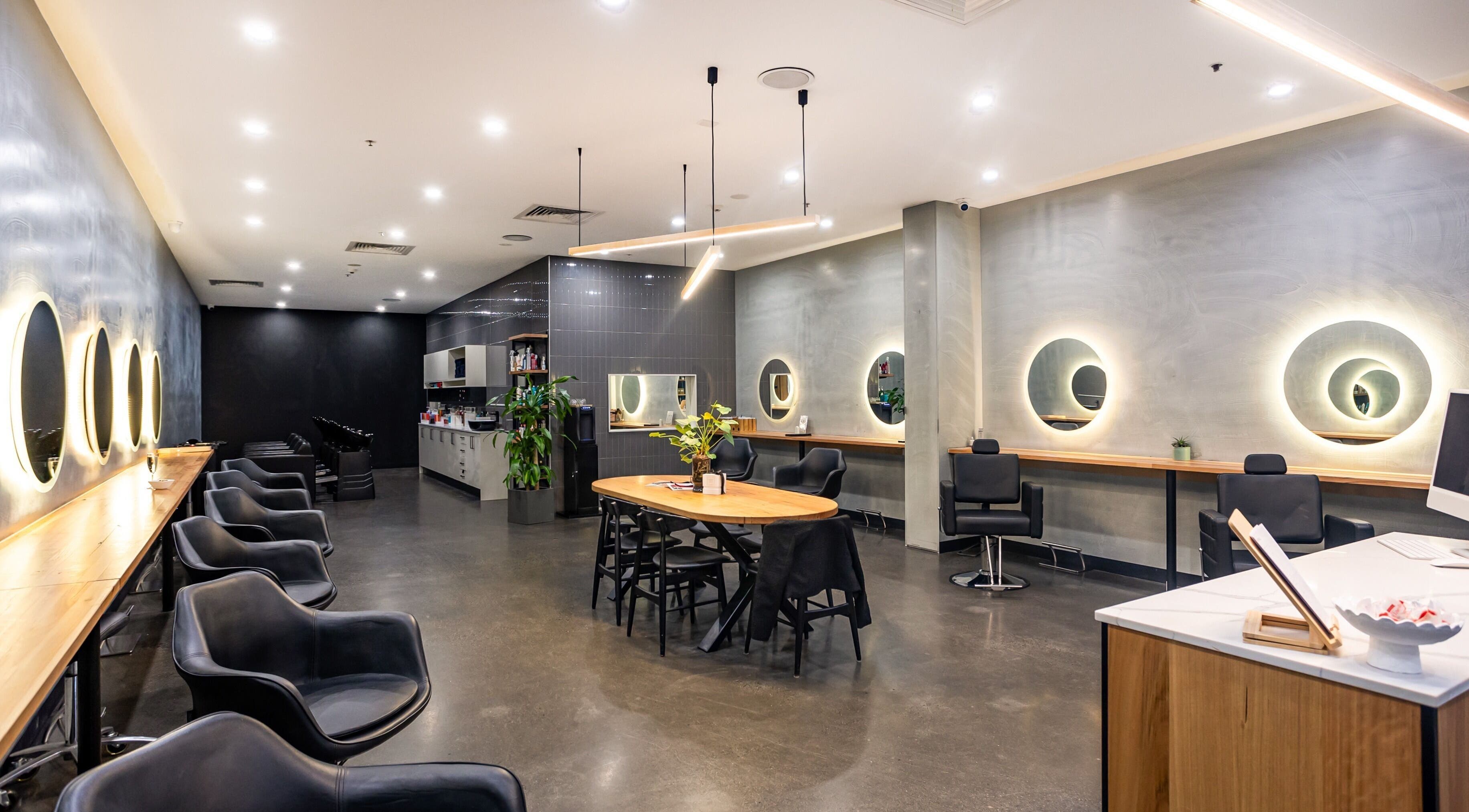 Elegant interior of DIJANA STANKOVSKA SALON, Melbourne, Victoria, AU with modern decor and ambient lighting.