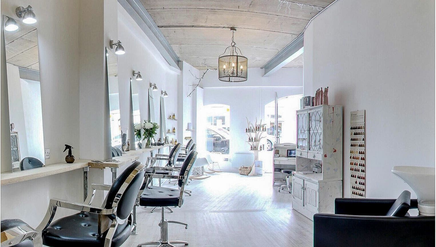 Chic and modern interior of The Styling Rooms in Rugby, England, GB, featuring stylish salon chairs and decor.