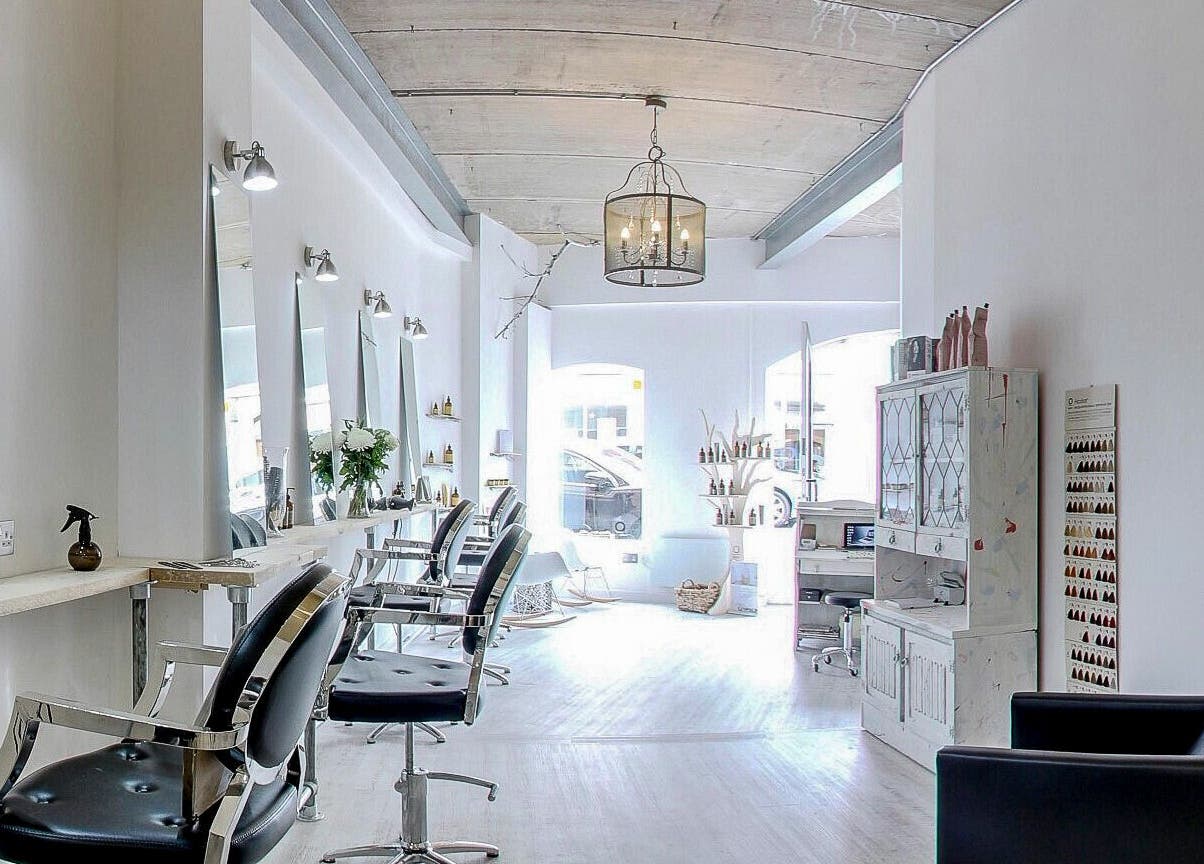 Chic and modern interior of The Styling Rooms in Rugby, England, GB, featuring stylish salon chairs and decor.