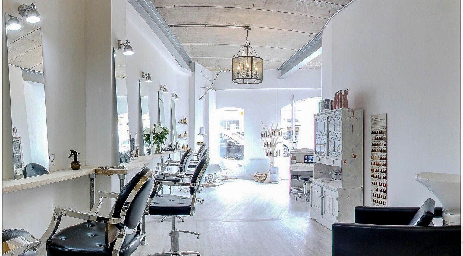 Chic and modern interior of The Styling Rooms in Rugby, England, GB, featuring stylish salon chairs and decor.