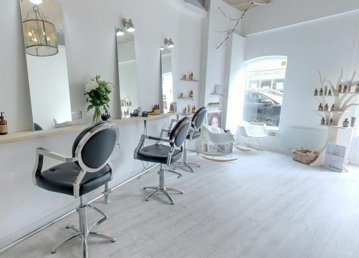 Elegant salon interiors at The Styling Rooms, Rugby, England, GB showcasing modern chairs and bright decor.