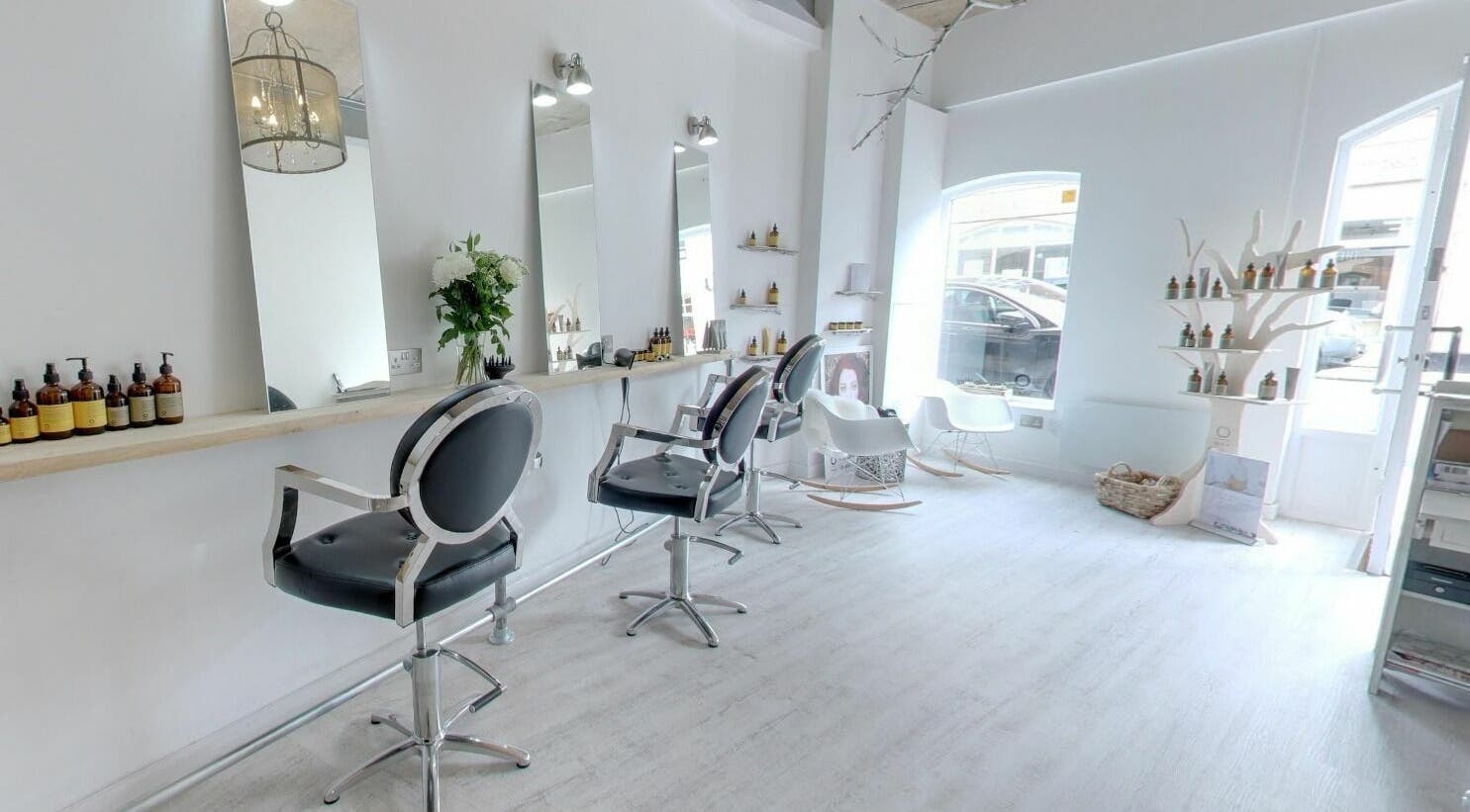 Elegant salon interiors at The Styling Rooms, Rugby, England, GB showcasing modern chairs and bright decor.