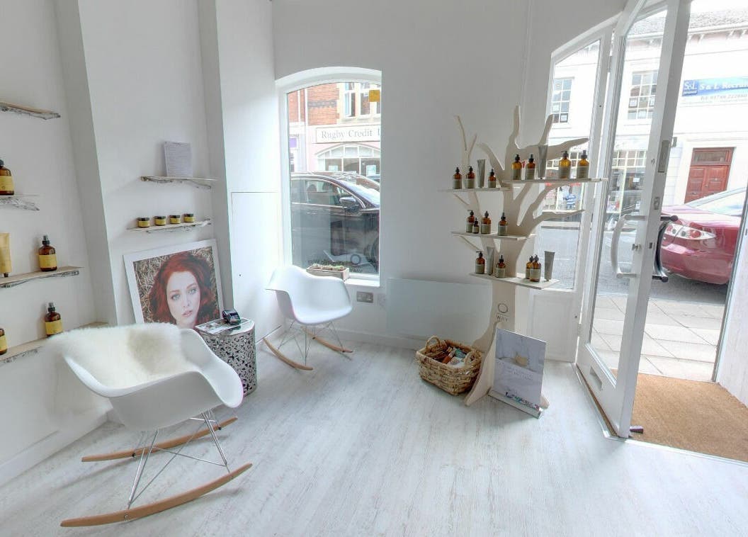 Elegant lounge at The Styling Rooms, Rugby, England, GB featuring modern chairs and beauty products.