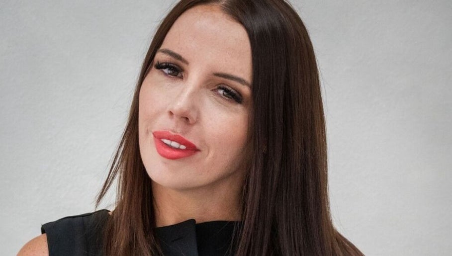 Portrait of a woman showcasing beauty treatments at FN Aesthetics in Denham, England, GB.