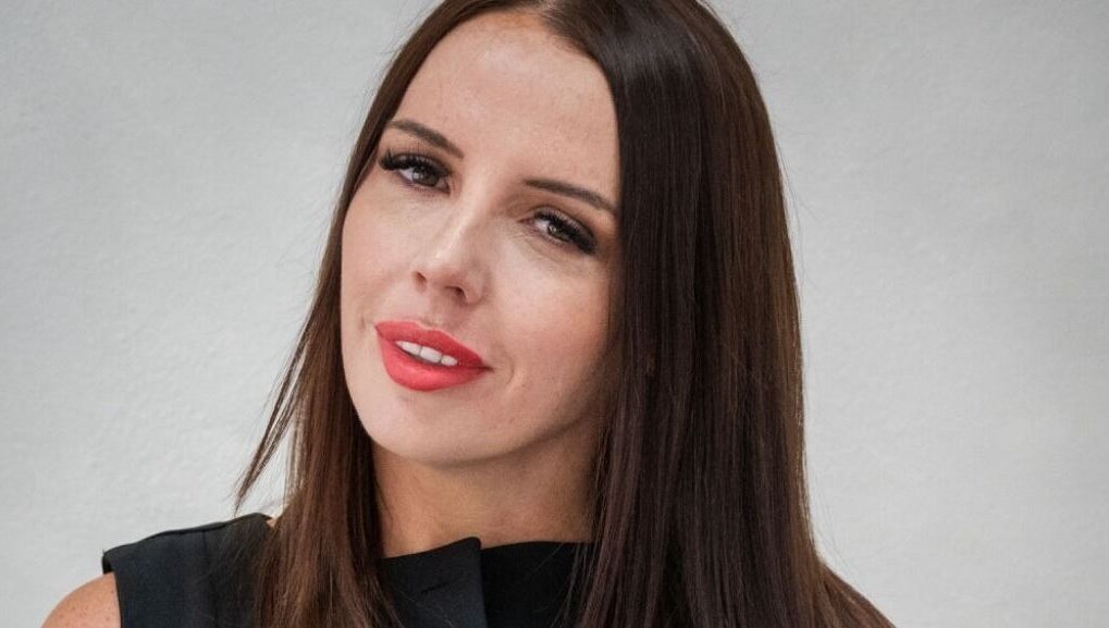 Portrait of a woman showcasing beauty treatments at FN Aesthetics in Denham, England, GB.