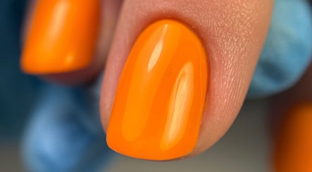Close-up of bright orange nail polish at Rita's Nails, Portsmouth, England, GB.