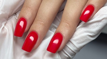 Bright red manicured nails at Rita’s Nails, Portsmouth, England, GB, showcasing professional nail care.