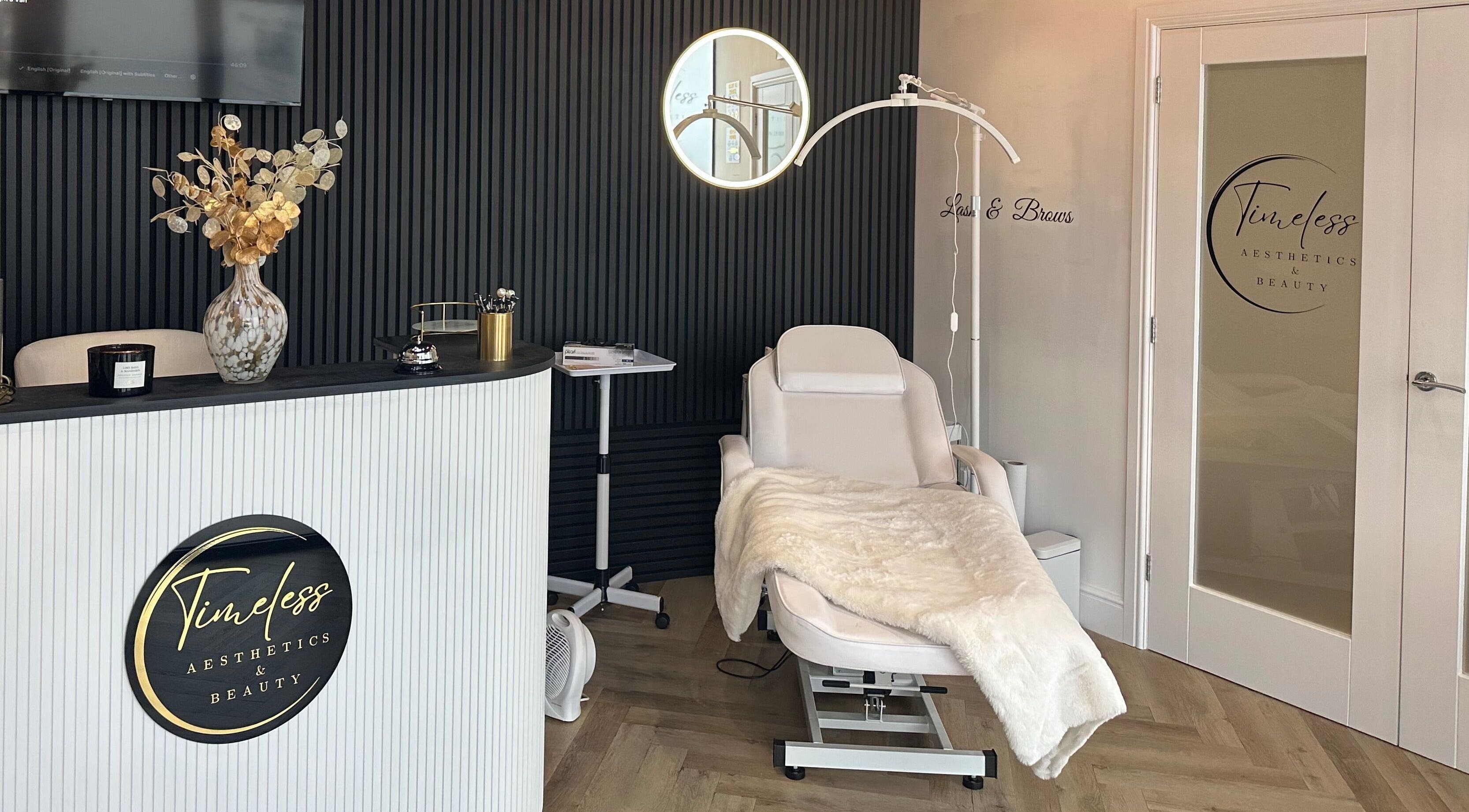 Interior of Timeless Aesthetics & Beauty in Lincoln, England, GB, featuring elegant decor and a plush treatment chair.