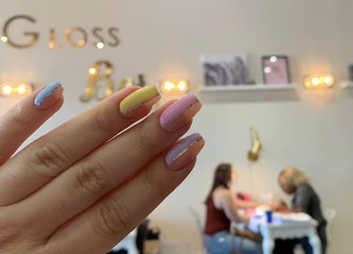 Stylish pastel manicure at Carlos Nails, Laval, Québec, CA, showcasing elegant nail art in vibrant colors.