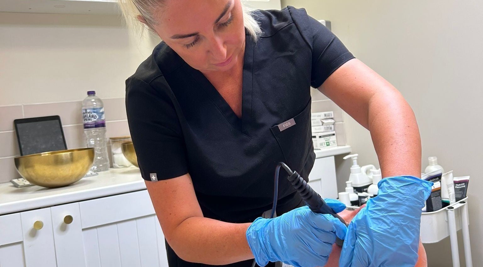Therapist at Skinfinity Holly Goodhew in Waterlooville, England, GB performing a professional beauty treatment.