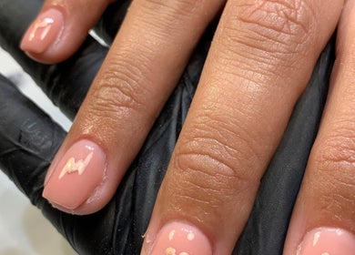 Close-up of manicured nails at Nail Tech Bec, None, England, GB, showcasing detailed pink nail art.