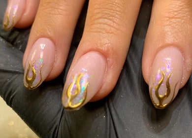 Elegant gold flame nail art at Nail Tech Bec in None, England, GB. Perfect for stylish designs.